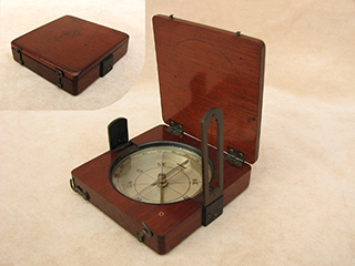 Antique mahogany cased needle pocket compass with twin sight vanes.